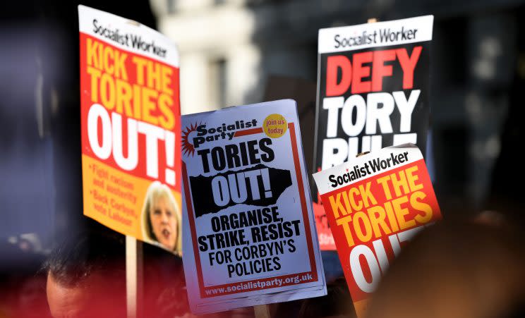 Protesters march against the Conservatives' arrangement with the DUP (Rex)