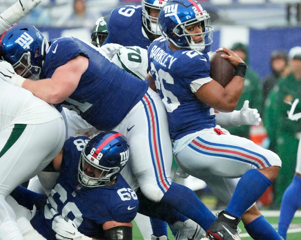 October 29, 2023; East Rutherford, NJ, USA; New York Giants running back Saquon Barkley (26) tries to move around the New York Jets offense.