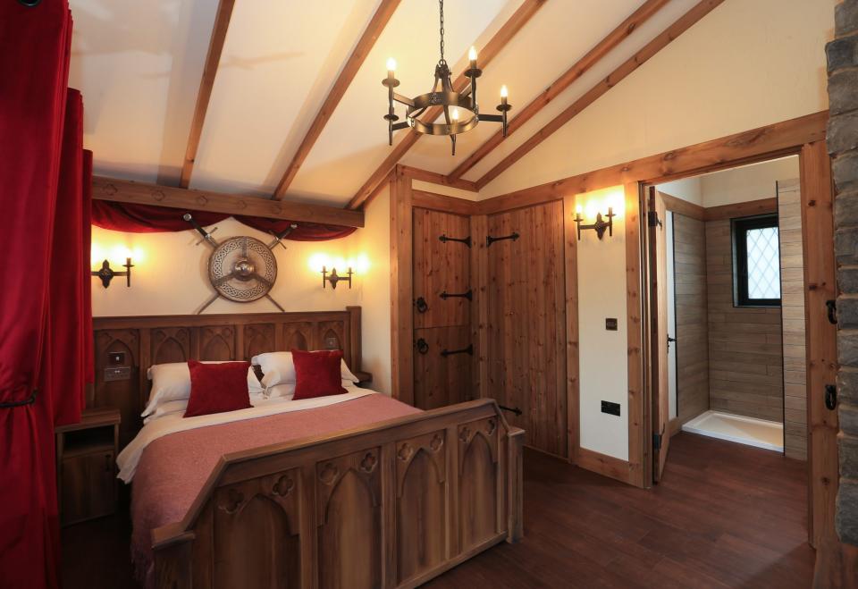 <p><span>For a right royal stay without the gilded price tag, book into </span><a rel="nofollow noopener" href="https://www.warwick-castle.com/accommodation/lodges-at-warwick-castle.aspx" target="_blank" data-ylk="slk:Warwick Castle;elm:context_link;itc:0;sec:content-canvas" class="link "><span>Warwick Castle</span></a><span>, where you can spend two days exploring and enjoying a candlelit dinner for Valentine’s Day. The price of £77 per person includes one night’s B&B accommodation in a medieval-themed Woodland Lodge, two days’ priority entrance to the castle, prosecco upon arrival and a romantic dinner accompanied by a string quartet. [Photo: Warwick Castle]</span> </p>