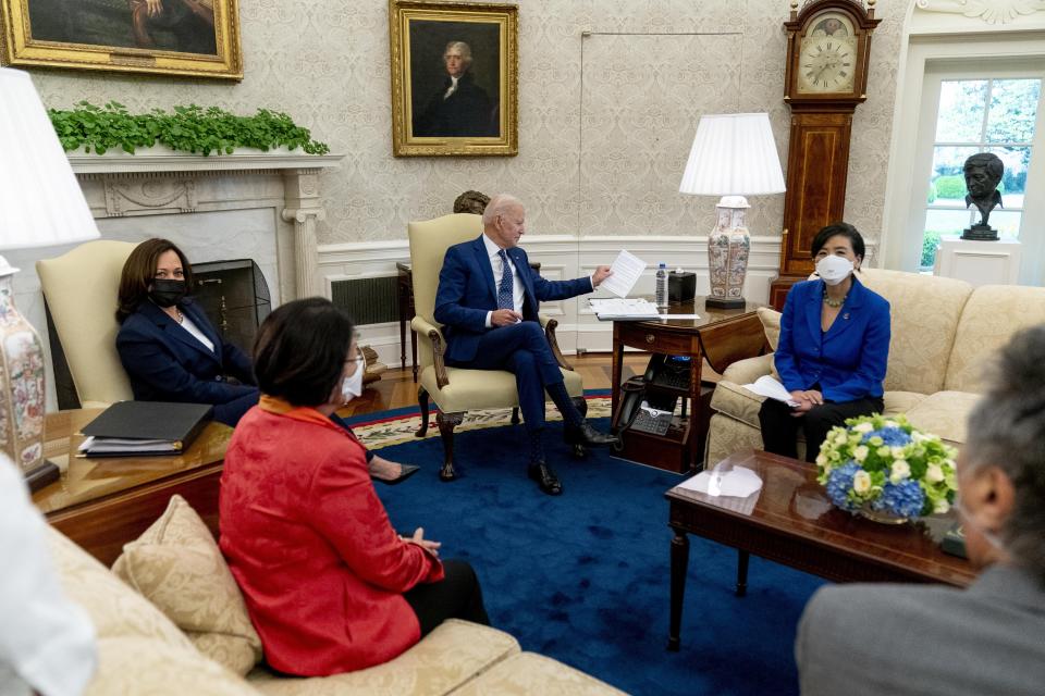 President Joe Biden, center, and Vice President Kamala Harris, meet with Sen. Mazie Hirono, D-Hawaii, second from left, Rep. Judy Chu, D-Calif., Mark Takano, D-Calif., right, and other members of the Congressional Asian Pacific American Caucus Executive Committee in the Oval Office at the White House in Washington, Thursday, April 15, 2021. (AP Photo/Andrew Harnik)