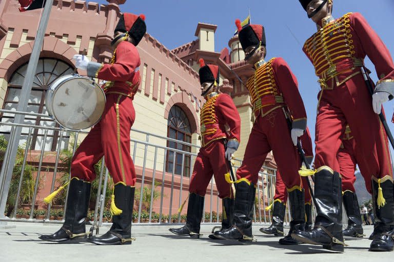 Members of the Honor Guard parade in front of the Mountain Barracks (Cuartel de la Montana) where the remains of late Venezuelan President Hugo Chavez are staying, in the 23 de Enero low income neighborhood in Caracas, on March 28, 2013