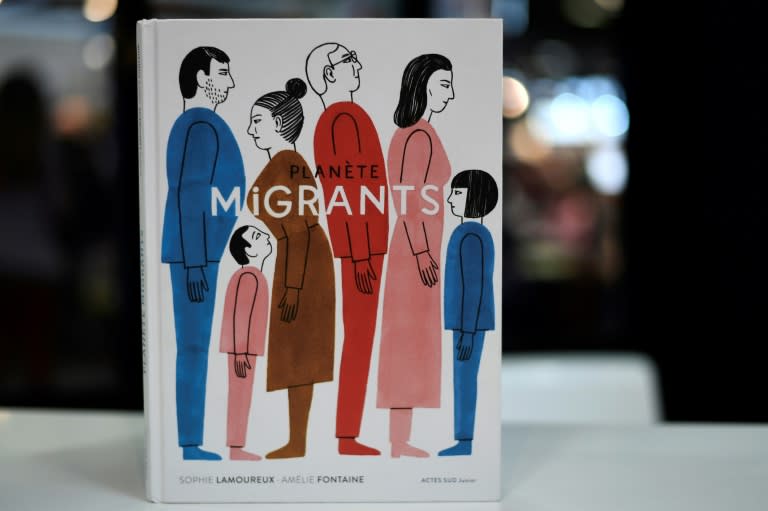 The French book "Planete Migrants" by Sophie Lamoureux and Amelie Fontaine is on display at the International Children's book fair on April 5, 2017 in Bologne