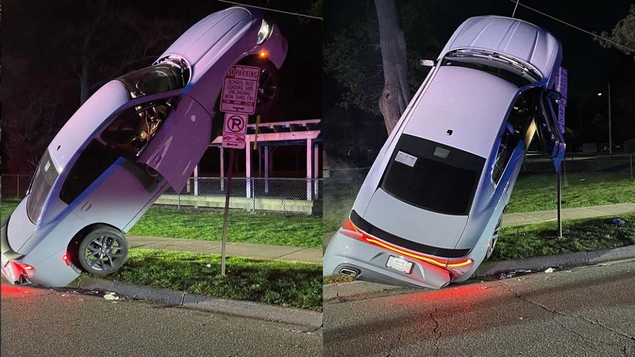 <div>Ann Arbor Police said a car went vertical after a drunk driver hit a guide wire and landed on a street sign.</div>