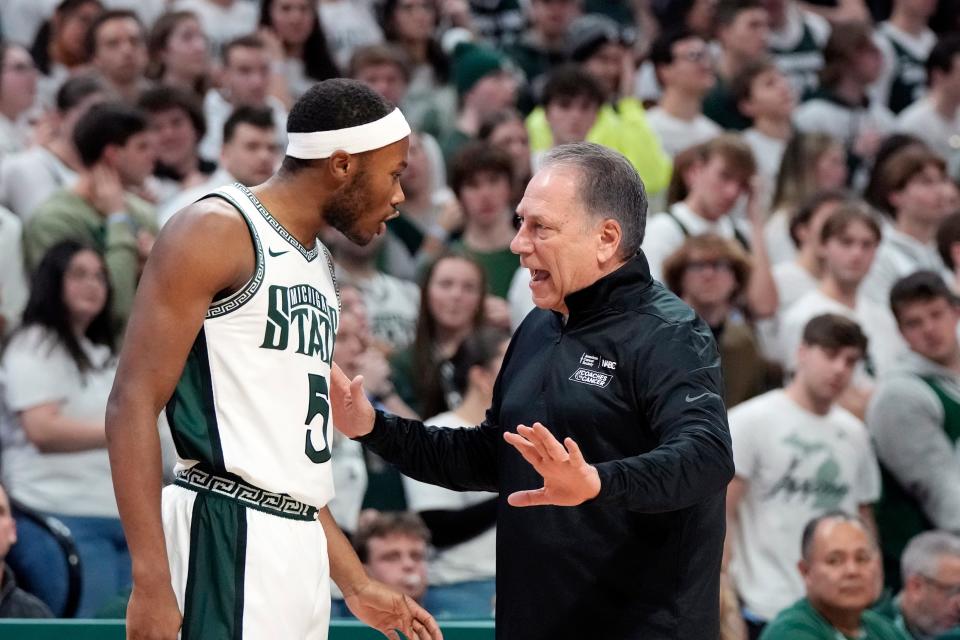 Michigan State head coach Tom Izzo talks to guard Tre Holloman (5) during the first half against Minnesota at Breslin Center in East Lansing on Thursday, Jan. 18, 2024.