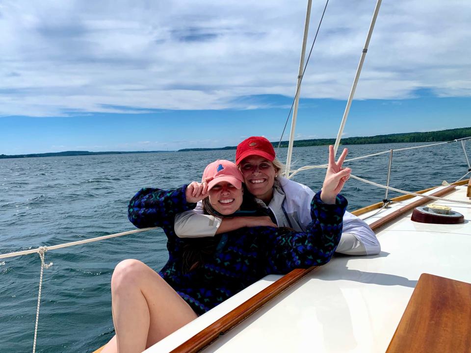 Author and a friend posing for a picture on a sailboat in Maryland