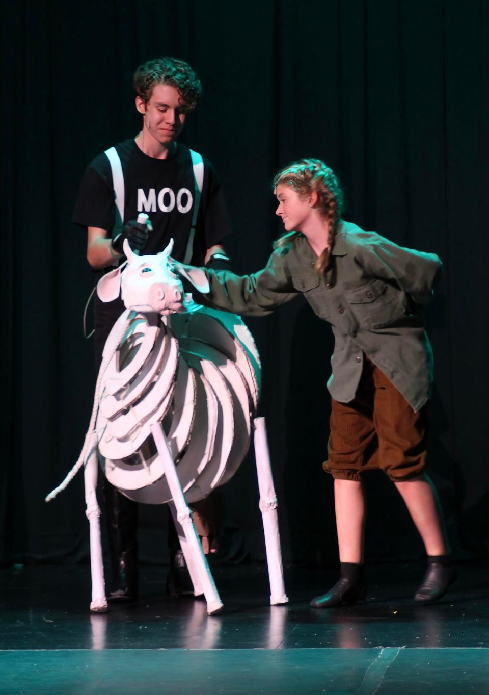 Remington Stavros puppeteering Milky White and Kate Strouss as Jack in the Palace Players production of “I Wish!” performed at Knoxville Catholic High School’s St. Gregory the Great Auditorium, July 22, 2023.