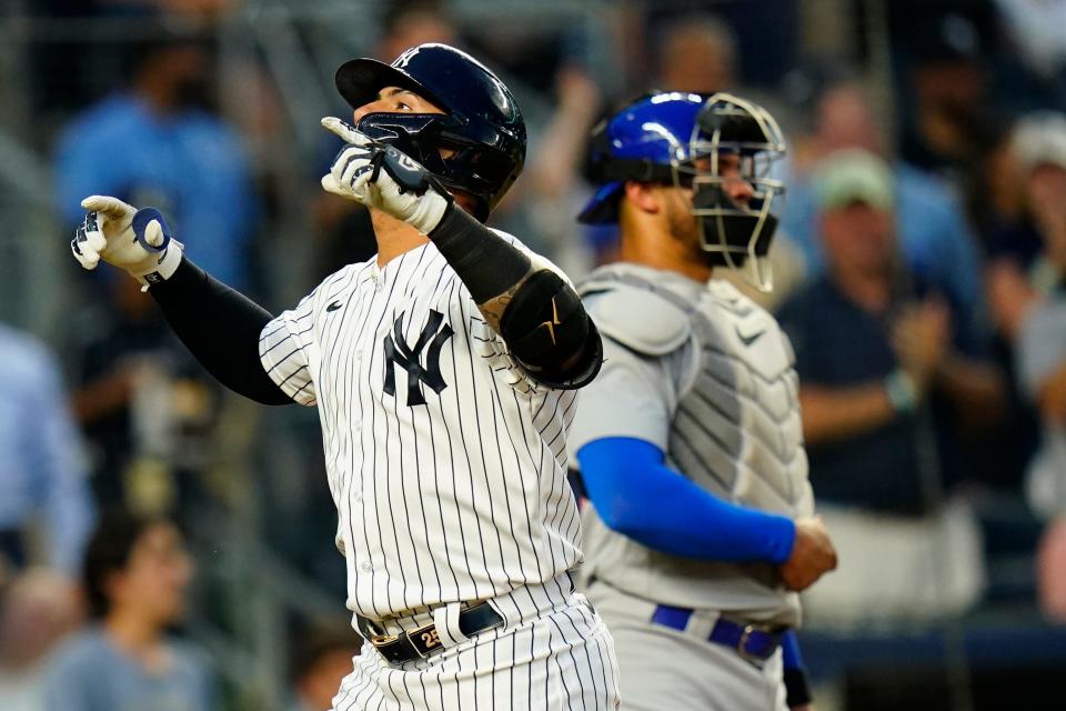 New York Yankees' Gleyber Torres, left, gestures as he reaches home plate after hitting a home run during the fourth inning of a baseball game against the Chicago Cubs, Friday, June 10, 2022, in New York. (AP Photo/Frank Franklin II)