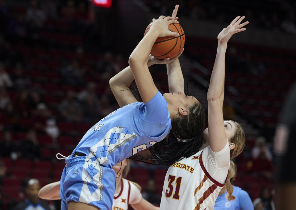 North Carolina guard Destiny Adams, left, shoots in front of Iowa State forward Morgan Kane during the first half of an NCAA college basketball game in the Phil Knight Invitational in Portland, Ore., Sunday, Nov. 27, 2022. (AP Photo/Craig Mitchelldyer)