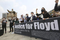 South Korean protesters stage a protest over the death of George Floyd, a black man who died after being restrained by Minneapolis police officers on May 25, near the U.S. embassy in Seoul, South Korea, Friday, June 5, 2020. (AP Photo/Ahn Young-joon)