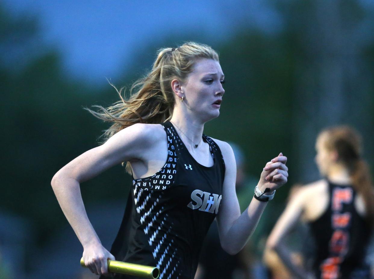 Maggie Fleischli carries the baton in the 4x400-meter relay during the Central State Eight Conference girls track and field meet at Memorial Stadium on Thursday, May 2, 2024. Chatham Glenwood won the team title.