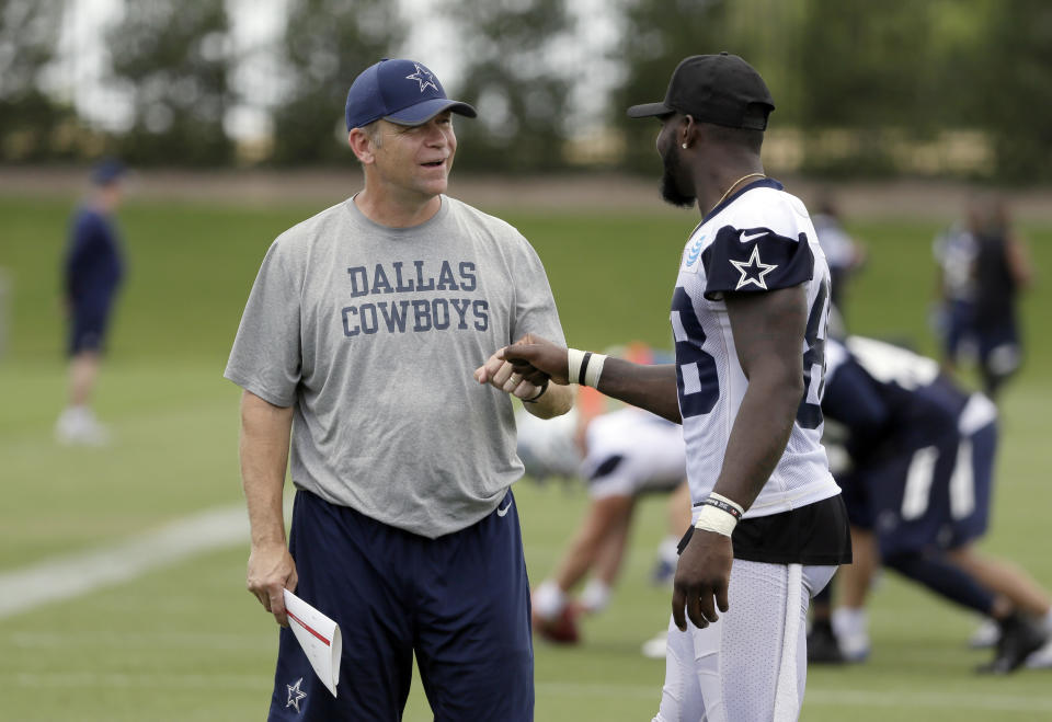 The play-calling of offensive coordinator Scott Linehan (L) faced heavy scrutiny this season. (AP) 
