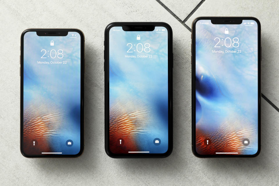 FILE - This Oct. 22, 2018, file photo shows the iPhone XS, from left, iPhone XR, and the iPhone XS Max in New York. Apple hoped to offset slowing demand for iPhones by raising the prices of its most important product, but that strategy seems to have backfired after sales sagged during the holiday shopping season. (AP Photo/Richard Drew, File)