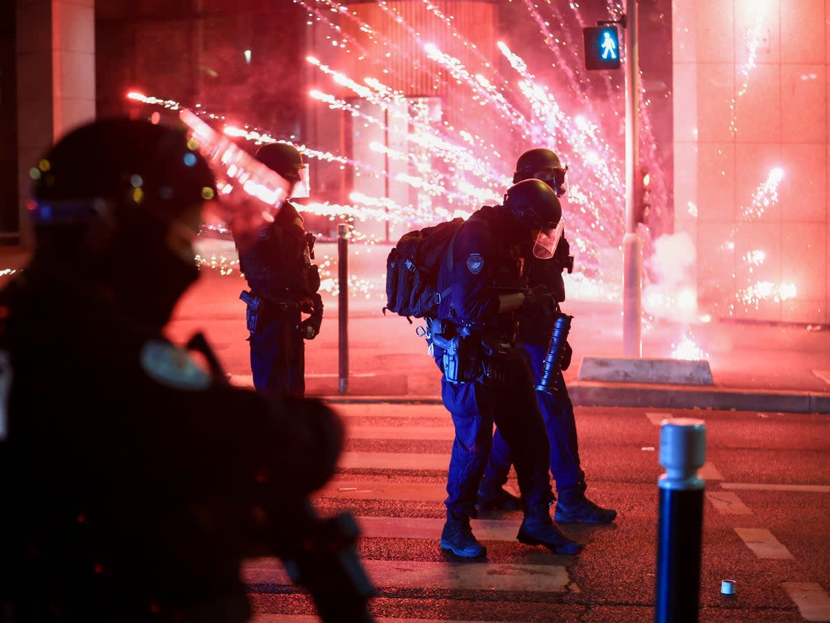 Riot police face demonstrators (AP)
