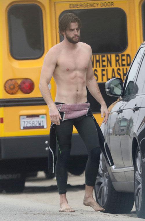 Liam Hemsworth strips off at the beach