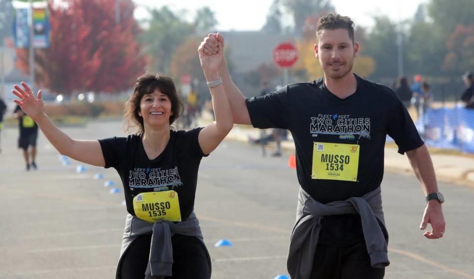 Amanda and Robert Musso of Clovis celebrate at the end of the Two Cities Half Marathon on Nov. 5, 2023.