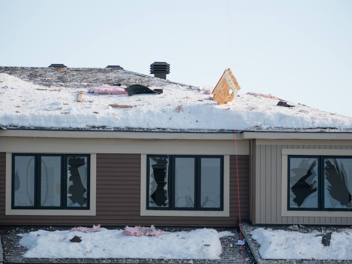 Damage is seen to a nearby house following an early morning explosion in the Ottawa's east-end suburb of Orléans. (Spencer Colby/The Canadian Press - image credit)