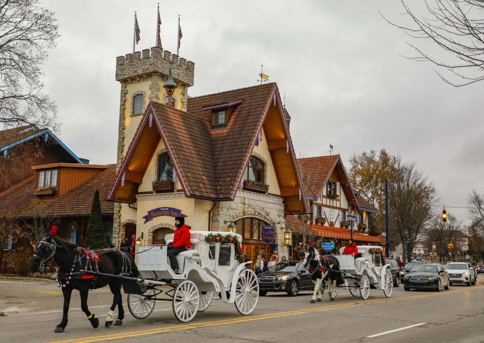 Two horse-drawn carriages are seen in the Bavarian-themed town of Frankenmuth in Michigan