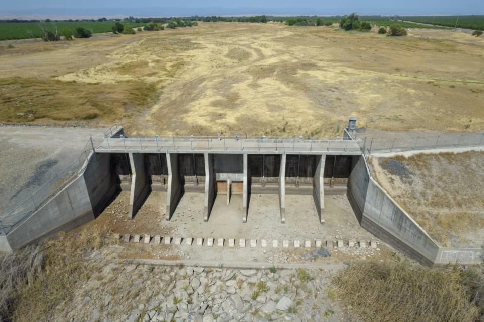 <div class="inline-image__caption"><p>The floodgates of the completely dry Berenda Reservoir in Chowchilla, California, U.S., on Monday, June 21, 2021. </p></div> <div class="inline-image__credit">Kyle Grillot/Bloomberg via Getty</div>