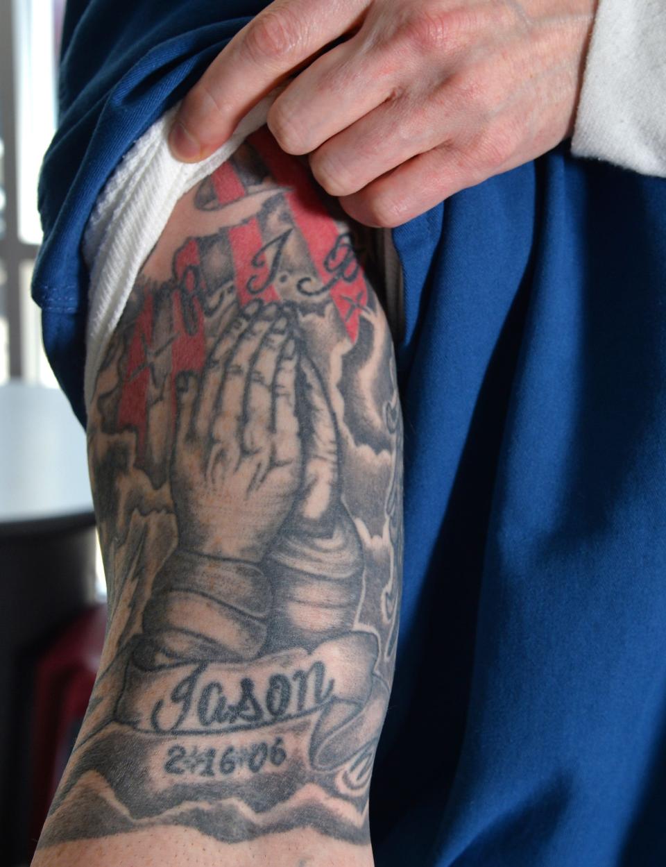 Jabe Carney, an inmate at Moore Haven Correctional Facility, displays a tattoo on his right bicep that honors his friend Jason Gibson. Carney is serving a 25 year sentence for DUI manslaughter and related charges for a crash that killed Gibson.