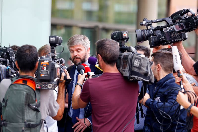 German Rodriguez, lawyer for Brazilian soccer player Neymar speaks with media members after he appeared before a judge in a case against Neymar's former club FC Barca in Barcelona