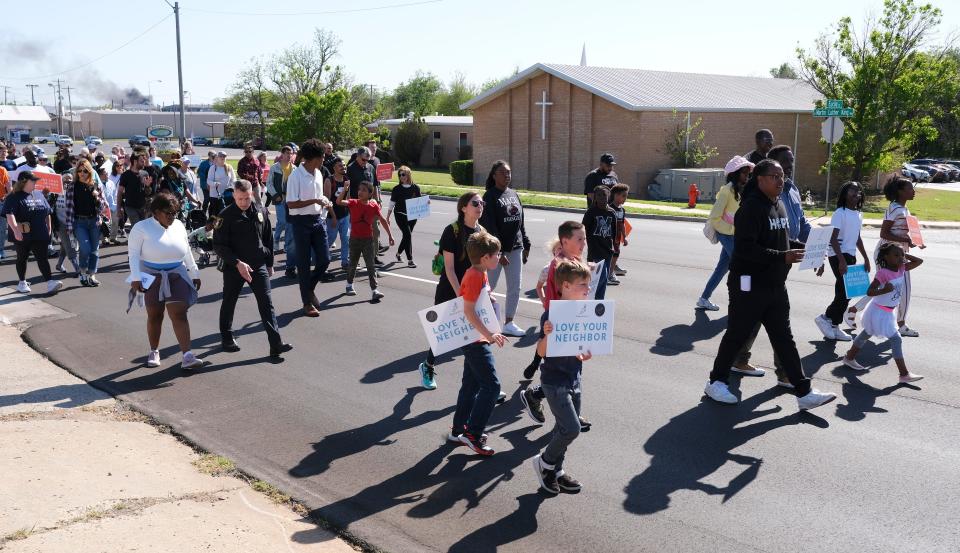 People march north on Martin Luther King Jr Blvd. at the Dream Peace Walk in Oklahoma City from Douglass High School to the Bridge Impact Youth Center, to celebrate the anniversary of Dr. Rev. Martin Luther King, Jr's Letters from Birmingham,  Sunday, April 16, 2023.