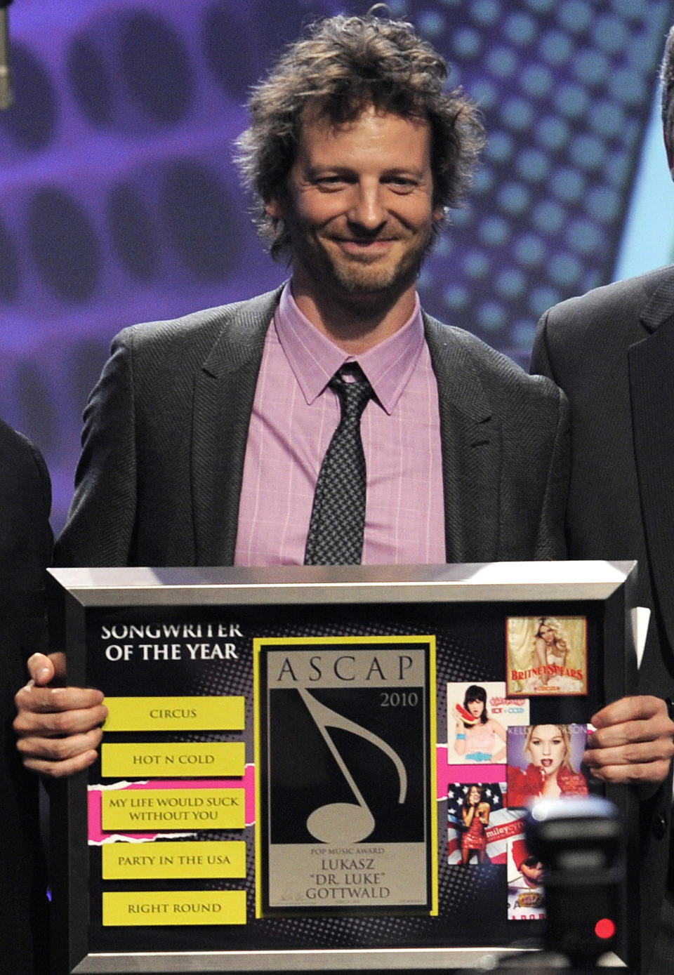 FILE - Lukasz "Dr. Luke" Gottwald accepts the Songwriter of the Year award at the 27th Annual ASCAP Pop Music Awards on April 21, 2010, in Los Angeles. The controversial music producer and hitmaker rose to the top of the Billboard charts with Doja Cat’s ubiquitous funk-pop jam “Say So,” along with Saweetie's anthemic bop “Tap In” and Juice WRLD's Top 5 pop smash “Wishing Well." He appeared as Tyson Trax on the Grammy ballot for Doja Cat's “Say So," which he produced and co-wrote. The hit tune is competing for record of the year, where he is contention as the song’s producer. (AP Photo/Chris Pizzello, File)