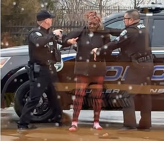 Butler Township police officers confront Latinka Hancock outside a McDonald's. (Courtesy of Wright & Schulte)