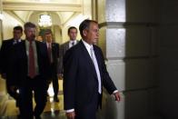 U.S. House Speaker John Boehner (R-OH) arrives for a late night closed-door meeting of the House Republican caucus during a rare Saturday session at the U.S. Capitol in Washington, September 28, 2013. The U.S. government edged closer on Saturday to a shutdown as Republicans in the House of Representatives rejected an emergency spending bill approved by the Senate and pushed instead for a one-year delay of President Barack Obama's healthcare reform law. REUTERS/Jonathan Ernst