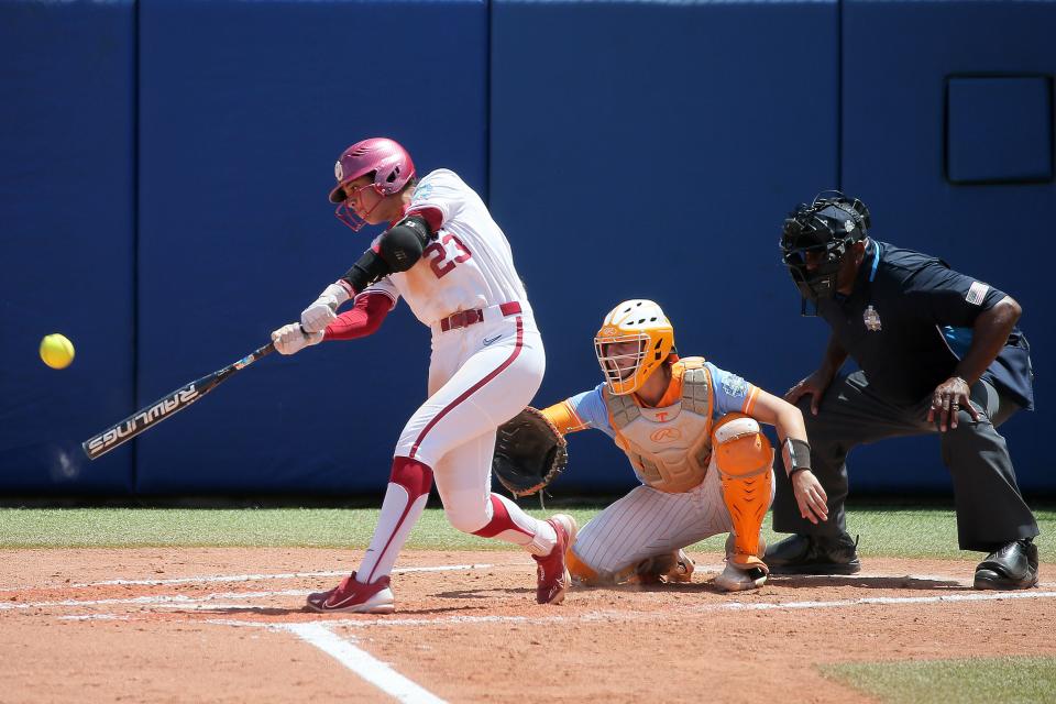 Oklahoma’s Tiare Jennings (23) hits a three-run home run in the second inning of a softball game between the University of Oklahoma Sooners (OU) and Tennessee in the Women’s College World Series at USA Softball Hall of Fame Stadium in Oklahoma City, Saturday, June 3, 2023.