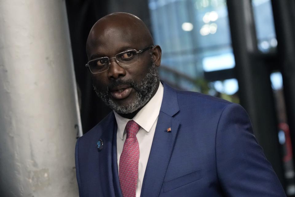 FILE - Liberia President George Weah arrives to attend the Paris Peace Forum, in Paris, France, Nov. 11, 2021. Liberian President George Weah is seeking a second term in office Tuesday, Oct. 10, 2023 hoping that his efforts to pave roads, build hospitals and bring electricity to more areas will win votes despite growing economic hardships in the West African nation. (AP Photo/Christophe Ena, File)