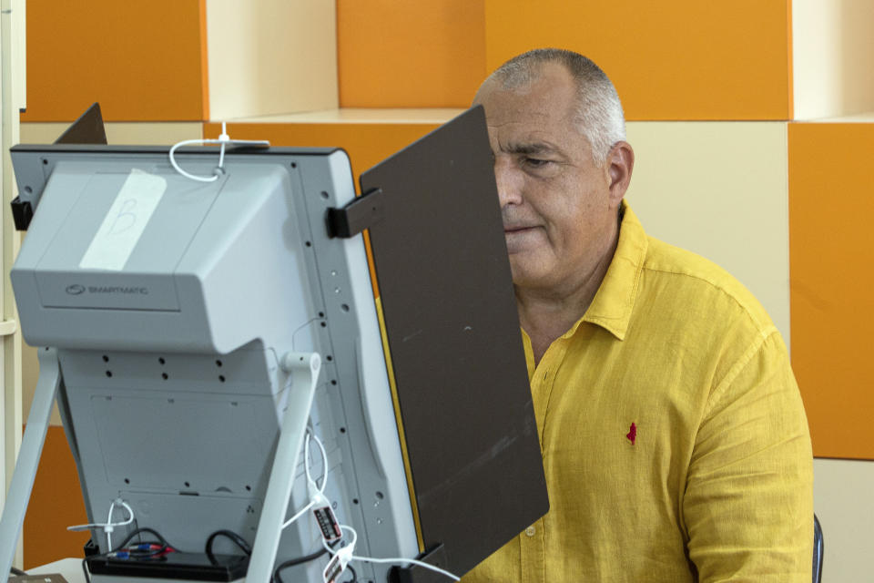 Bulgarian former prime minister Boyko Borissov electronically casts his ballot during parliamentary elections in the town of Bankya near capital Sofia, Bulgaria on Sunday, July 11, 2021. Bulgarians are voting in a snap poll on Sunday after a previous election in April produced a fragmented parliament that failed to form a viable coalition government. Latest opinion polls suggest that the rerun could produce similar results but also a further drop in support for former Prime Minister Boyko Borissov's GERB party, after the current caretaker government made public allegations of widespread corruption during his rule. (AP PHOTO/Visar Kryeziu)