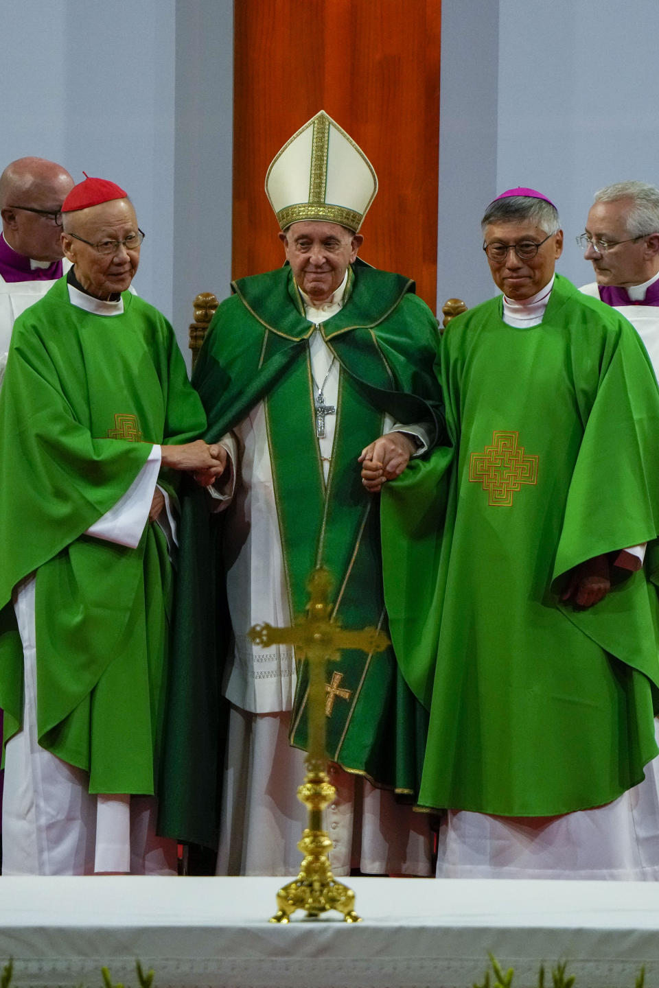 Pope Francis is joined by Cardinal John Tong Hon, left, and Cardinal-elect Stephen Chow, both from Hong Kong, after presiding over a mass at the Steppe Arena in the Mongolian capital Ulaanbaatar, Sunday, Sept. 3, 2023. Francis is in Mongolia to minister to one of the world's smallest and newest Catholic communities. Neighboring China's crackdown on religious minorities has been a constant backdrop to the trip, even as the Vatican hopes to focus attention instead on Mongolia and its 1,450 Catholics. (AP Photo/Ng Han Guan)