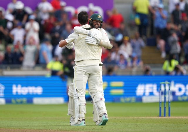 Australia’s Pat Cummins and Nathan Lyon celebrate