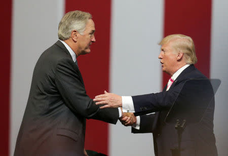 Senator Luther Strange and President Donald Trump shake hands after Trumps's speech during a rally at the Von Braun Centre in Huntsville, Alabama, U.S. September 22, 2017. REUTERS/Marvin Gentry