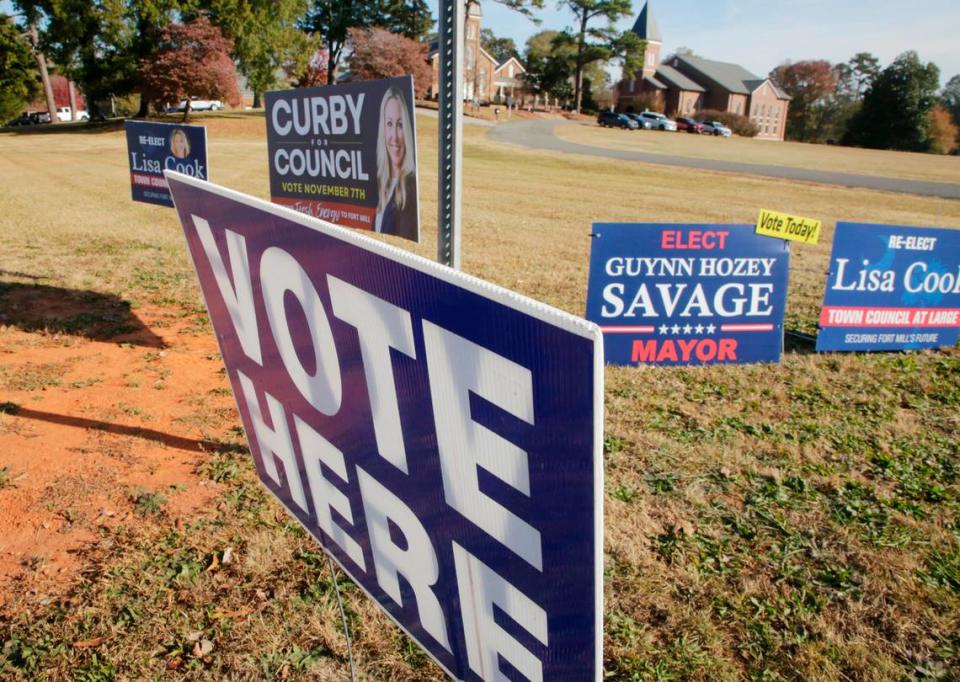 Campaign signs and a “vote here” sign alert passers-by at Unity Presbyterian Church in Fort Mill on Tuesday. Across York County, seven mayoral seats were among 34 total elected positions on voters’ ballots, spanning eight cities or towns.