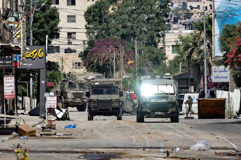 Israeli army vehicles at the entrance to Jenin in the occupied West Bank during the raid (Zain JAAFAR)