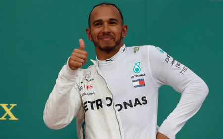 Formula One - F1 - Azerbaijan Grand Prix - Baku City Circuit, Baku, Azerbaijan - April 29, 2018 Mercedes' Lewis Hamilton celebrates on the podium after winning the race REUTERS/David Mdzinarishvili