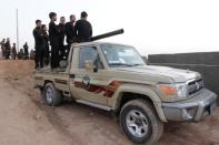 Kurdish Peshmerga fighters ride in a vehicule in the Southwest of Kirkuk, Iraq October 13, 2017. REUTERS/Ako Rasheed