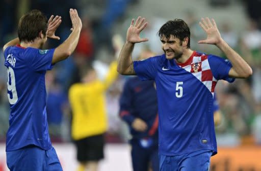 Croatian defender Vedran Corluka (R) and Croatian forward Nikica Jelavic celebrate at the end of the Euro 2012 championships football match Republic of Ireland vs Croatia at the Municipal Stadium in Poznan. Croatia won 3 to 1