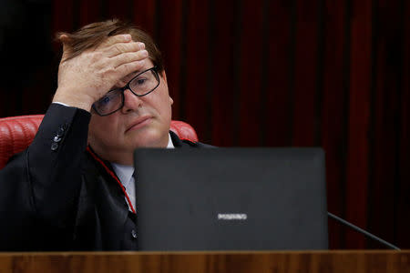 Judge Herman Benjamin reacts during a meeting at the Supreme Electoral Court (TSE) to debate whether to annul the Rousseff-Temer ticket in the 2014 election for receiving illegal campaign donations, in Brasilia, Brazil April 4, 2017. REUTERS/Ueslei Marcelino