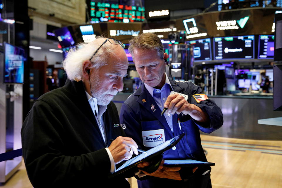 Traders work on the floor of the New York Stock Exchange (NYSE) in New York City, U.S., October 20, 2021.  REUTERS/Brendan McDermid