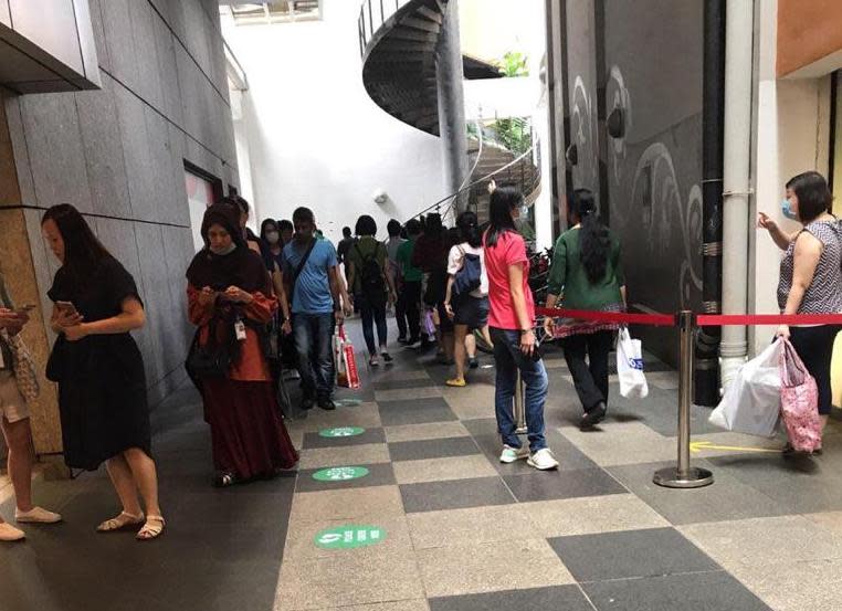 Patrons queueing in between Novena Square and Square 2 on 27 March, 2020. (PHOTO: Yahoo News Singapore reader)