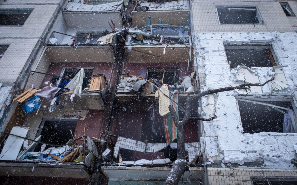 A view of the destroyed facade of a residential high-rise building after a Russian missile attack