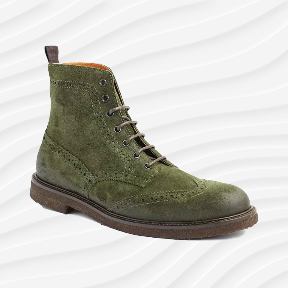 the bruno magli gleason wingtip boo in olive suede on a white wavy background