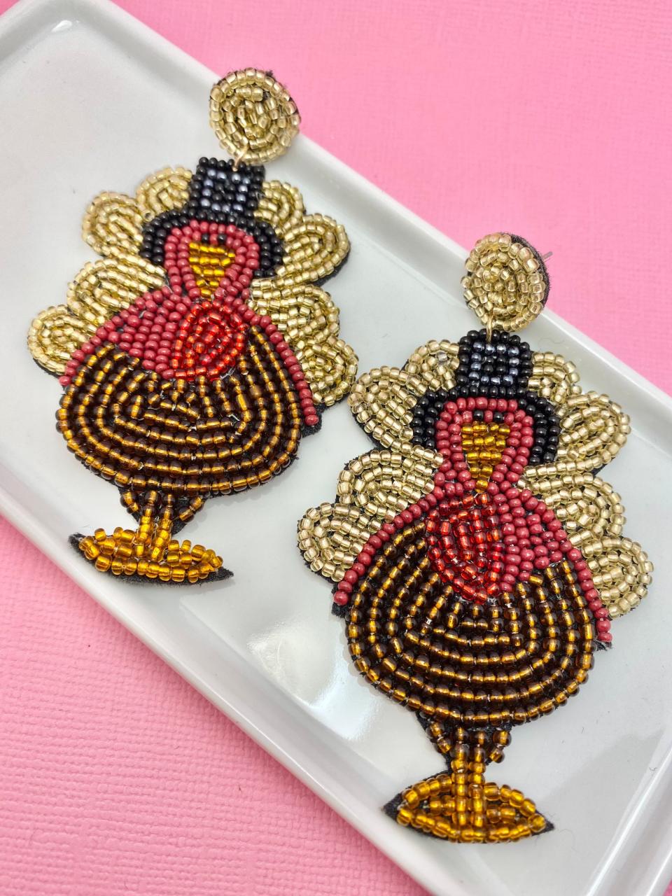 <p><a href="https://go.redirectingat.com?id=74968X1596630&url=https%3A%2F%2Fwww.etsy.com%2Flisting%2F1104250812%2Fthanksgiving-turkey-beaded-earrings&sref=https%3A%2F%2Fwww.thepioneerwoman.com%2Ffashion-style%2Fg41915916%2Fthanksgiving-earrings%2F" rel="nofollow noopener" target="_blank" data-ylk="slk:Shop Now;elm:context_link;itc:0;sec:content-canvas" class="link ">Shop Now</a></p><p>Thanksgiving Turkey Beaded Earrings</p><p>$25.00</p><p>etsy.com</p><span class="copyright">Etsy</span>