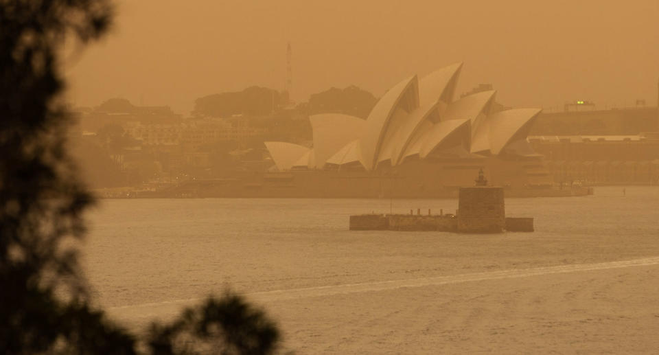 Smokey haze shown blanketing The Sydney Opera House amid bushfires across NSW Tuesday.