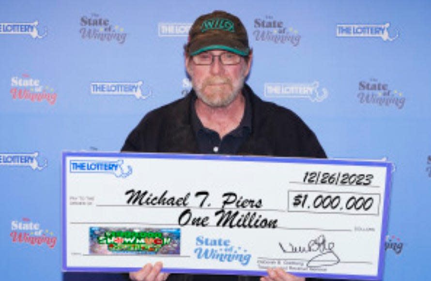 Michael Piers with his $1 million check.