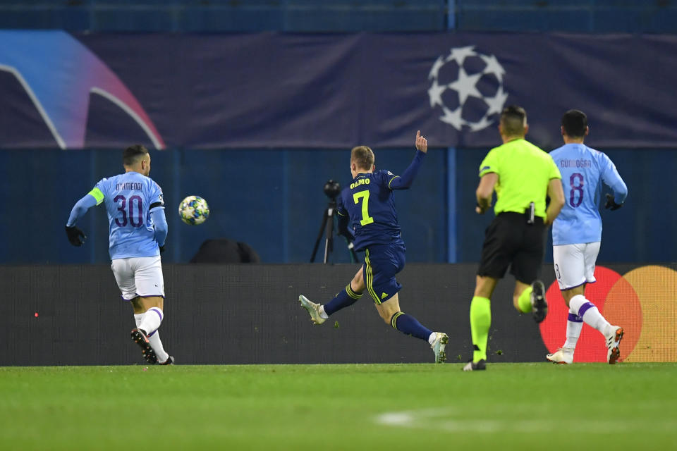 ZAGREB, CROATIA - DECEMBER 11: Dani Olmo of GNK Dinamo Zagreb scores his team's first goal past Nicolas Otamendi of Manchester City during the UEFA Champions League group C match between Dinamo Zagreb and Manchester City at Maksimir Stadium on December 11, 2019 in Zagreb, Croatia. (Photo by Dan Mullan/Getty Images)