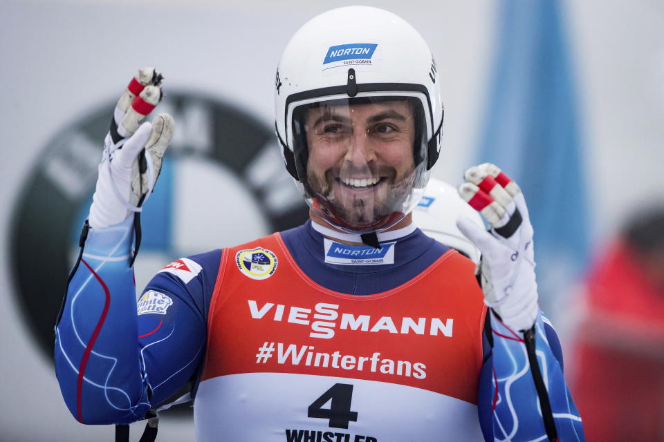 Chris Mazdzer reacts after he and Jayson Terdiman, back, of the United States, raced to a seventh-place finish during a luge World Cup doubles event in Whistler, British Columbia, Friday, Nov. 30, 2018. (Darryl Dyck/The Canadian Press via AP)