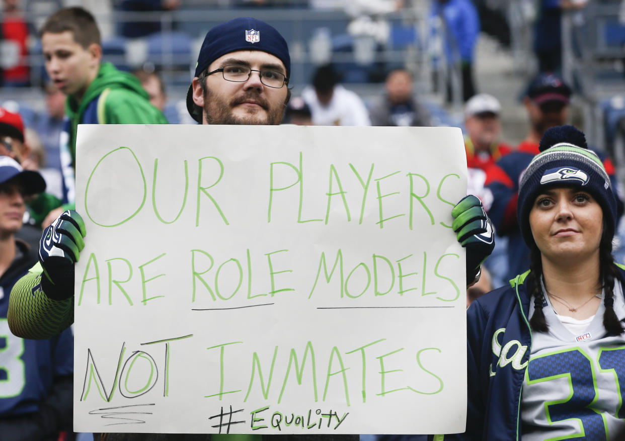 A Seahawks fan holds a sign referencing a comment made by Houston Texans owner Bob McNair before the game between the Houston Texans and Seattle Seahawks at CenturyLink Field on October 29, 2017. (Getty)